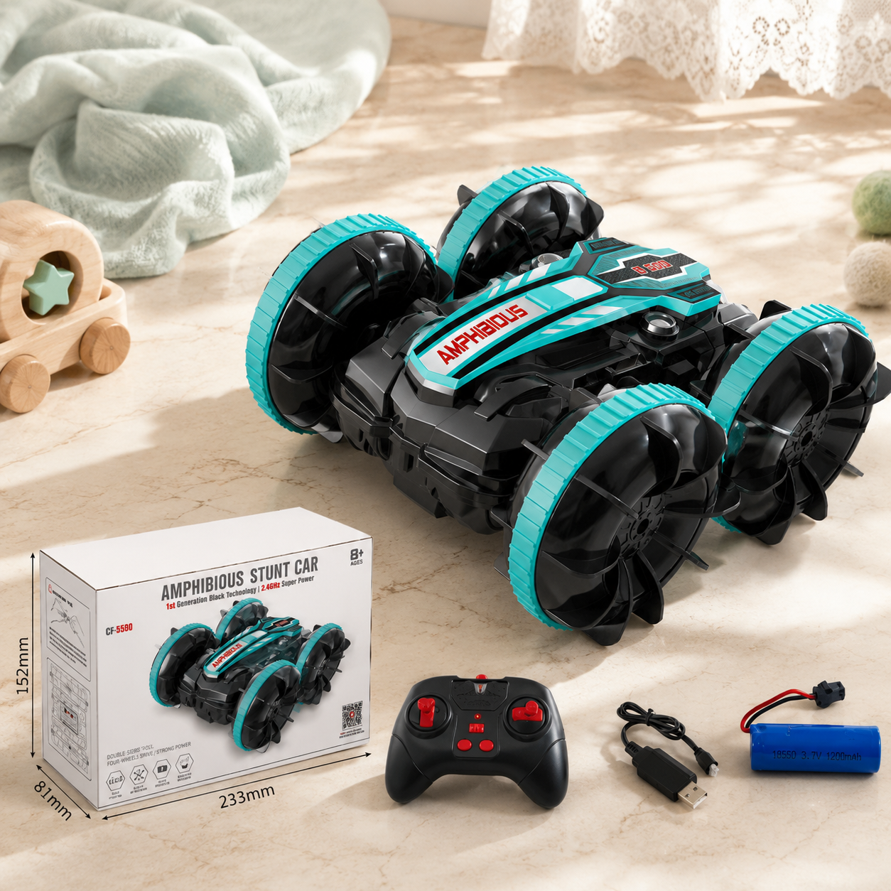 Amphibious stunt car with remote control, battery, and packaging on a wooden surface.